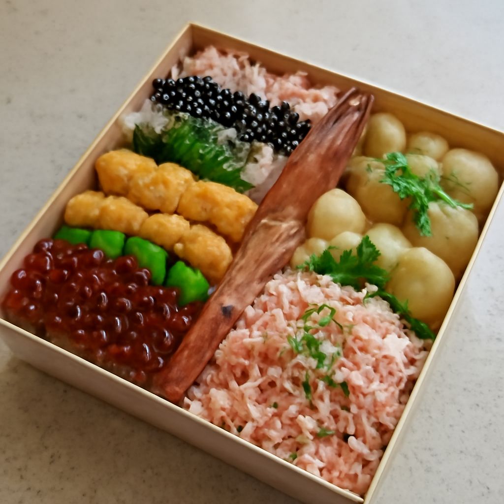 Bento box restaurant meal with assorted Japanese dishes