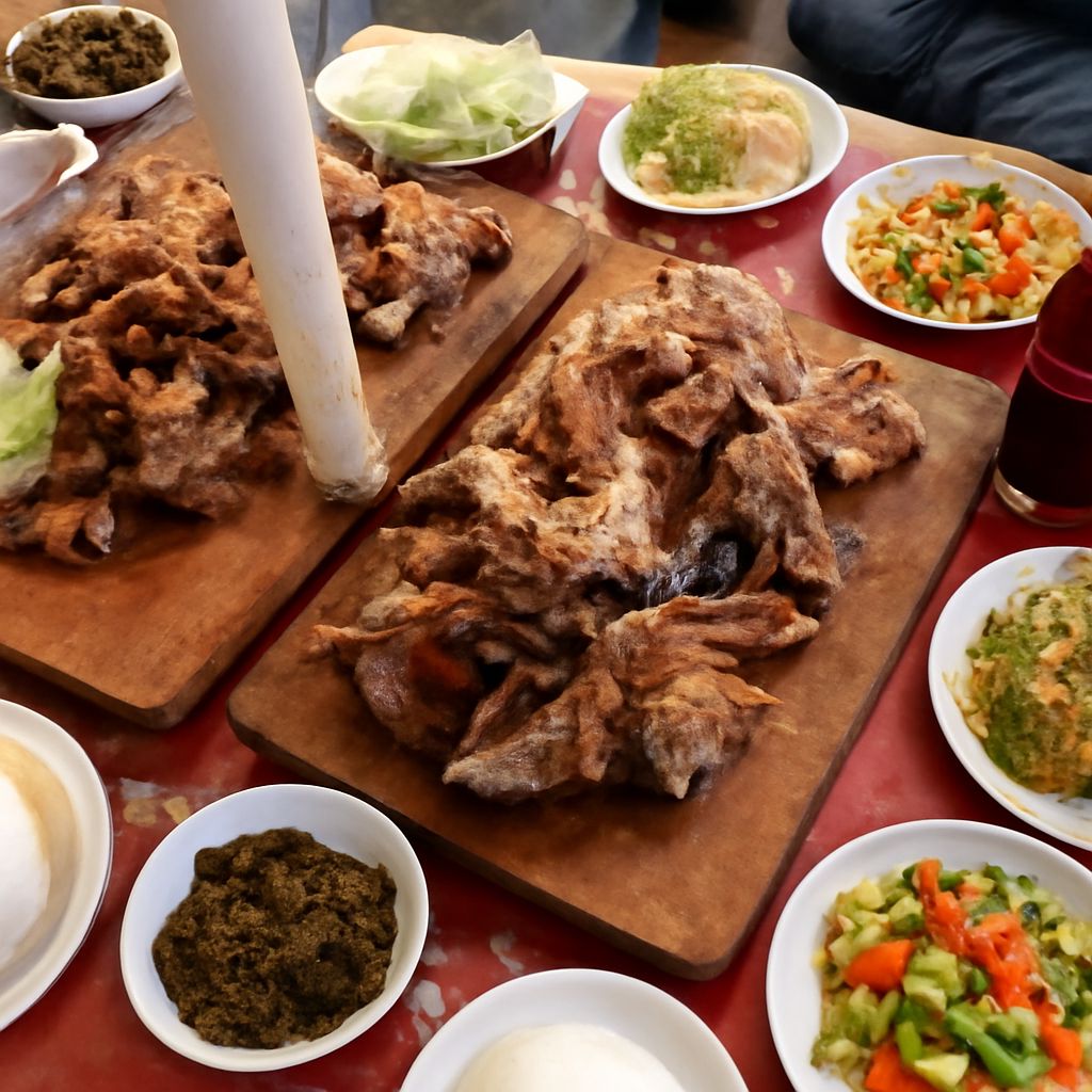 Kenyan cuisine served as ugali, sukuma wiki, githeri, pilau, chapati, and nyama choma