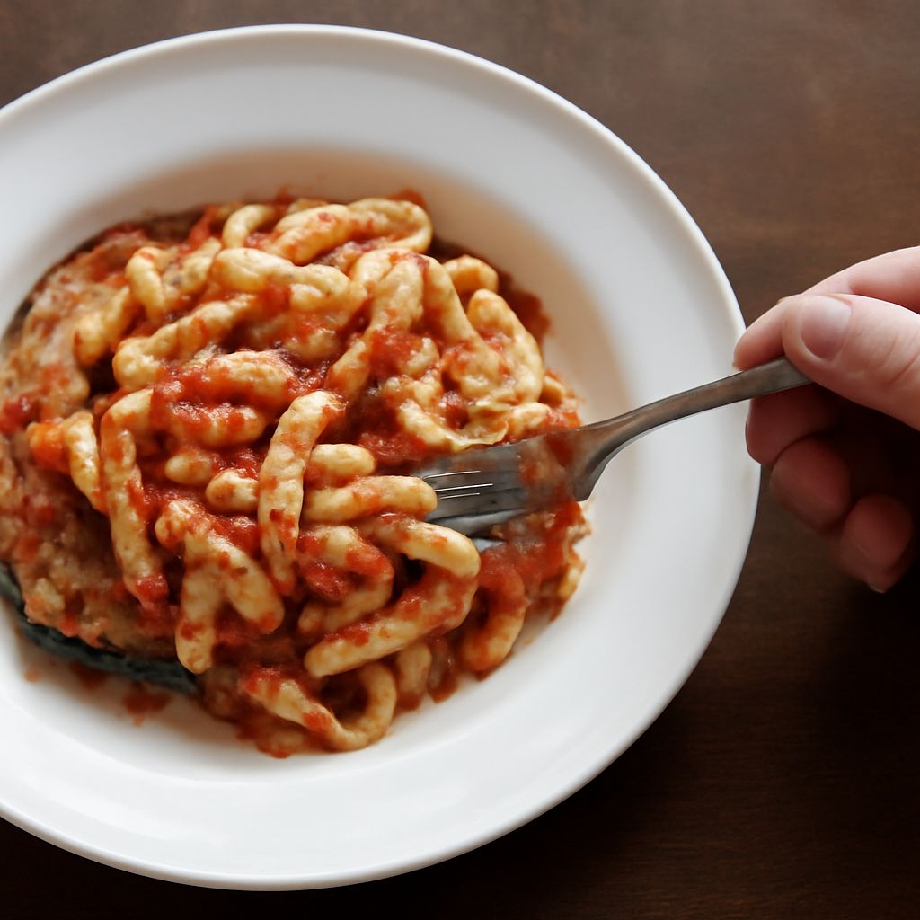 Sicilian dishes including pasta alla Norma, caponata, arancine, panelle, and cannoli